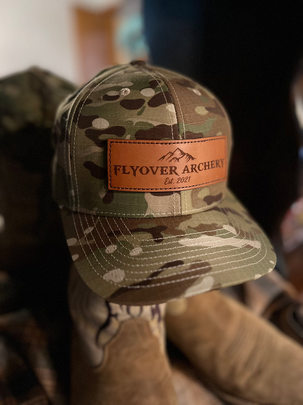 Camo Flyover Archery hat with leather patch.